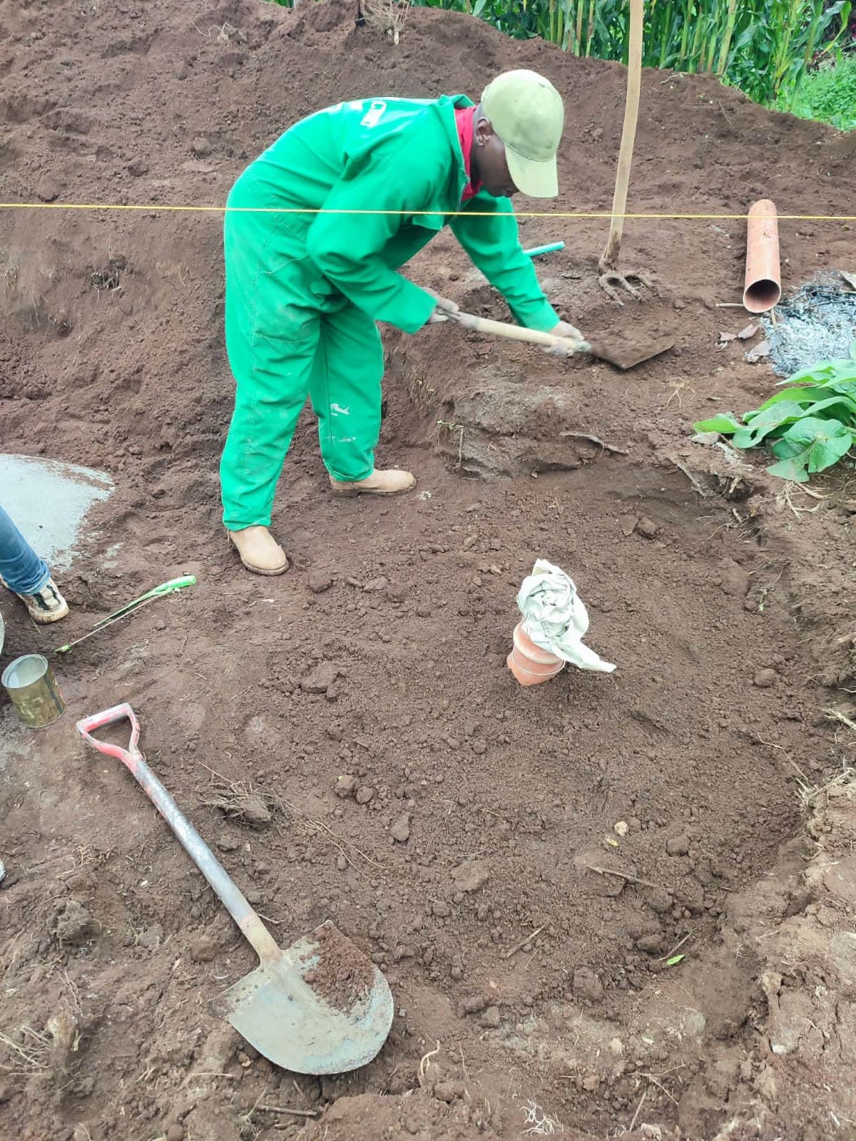 Backfilling around the finished tank — the last step on site